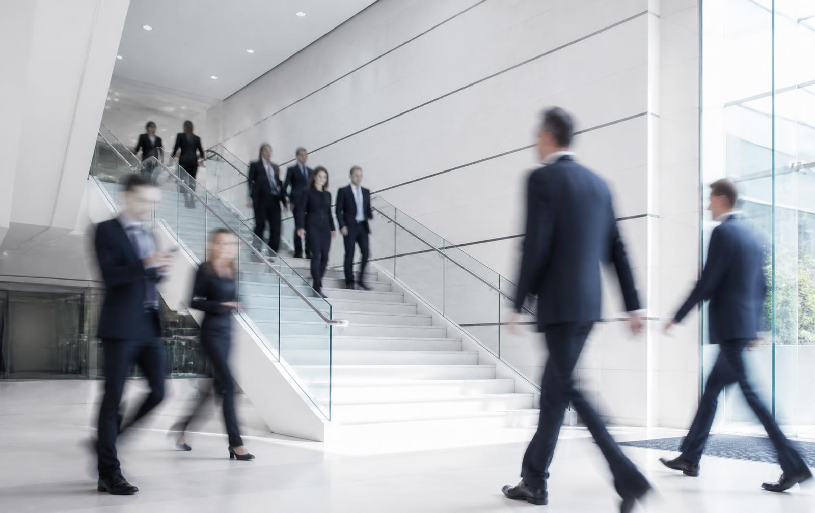 Colleagues walking through the Blake Atlantic headquarters lobby